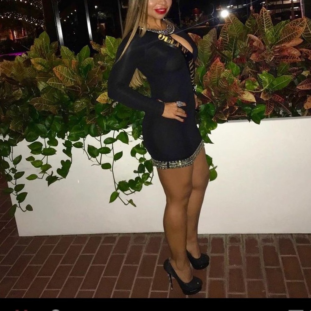Beautiful sexy mini dress front open and neck and bottom crystal details.